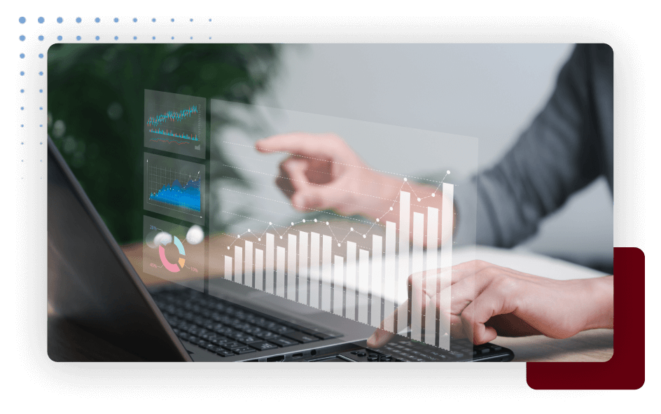 A business executive analyzing data on a laptop screen with graphs.